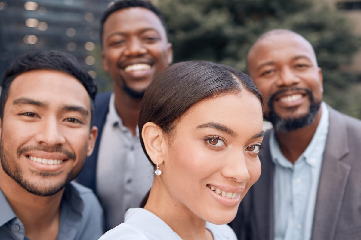 Making memories together. Shot of a group of businesspeople standing outside together